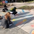 Students making chalk art