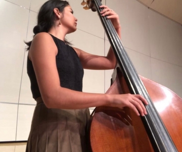 Sierra Contreras playing stand-up string instrument