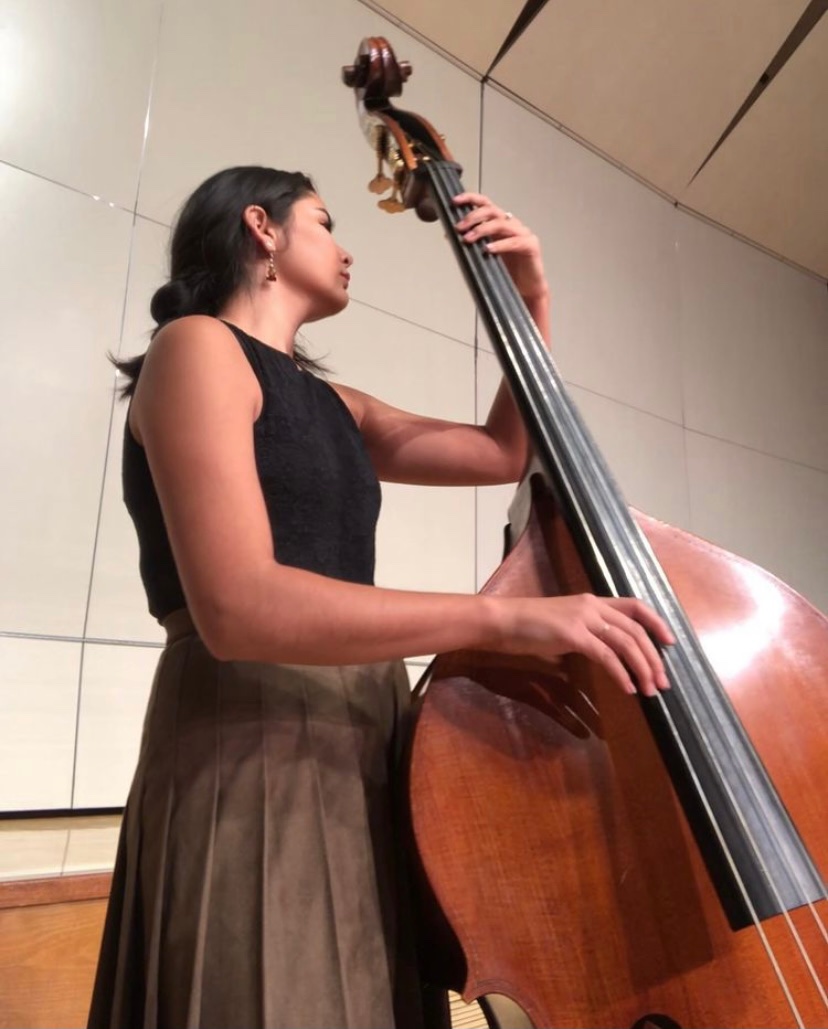 Sierra Contreras playing stand-up string instrument