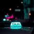taxi in dark city with neon lights