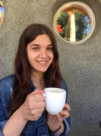 Melanie holding coffee cup