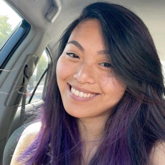 Jessica Mananquil in car with purple hair