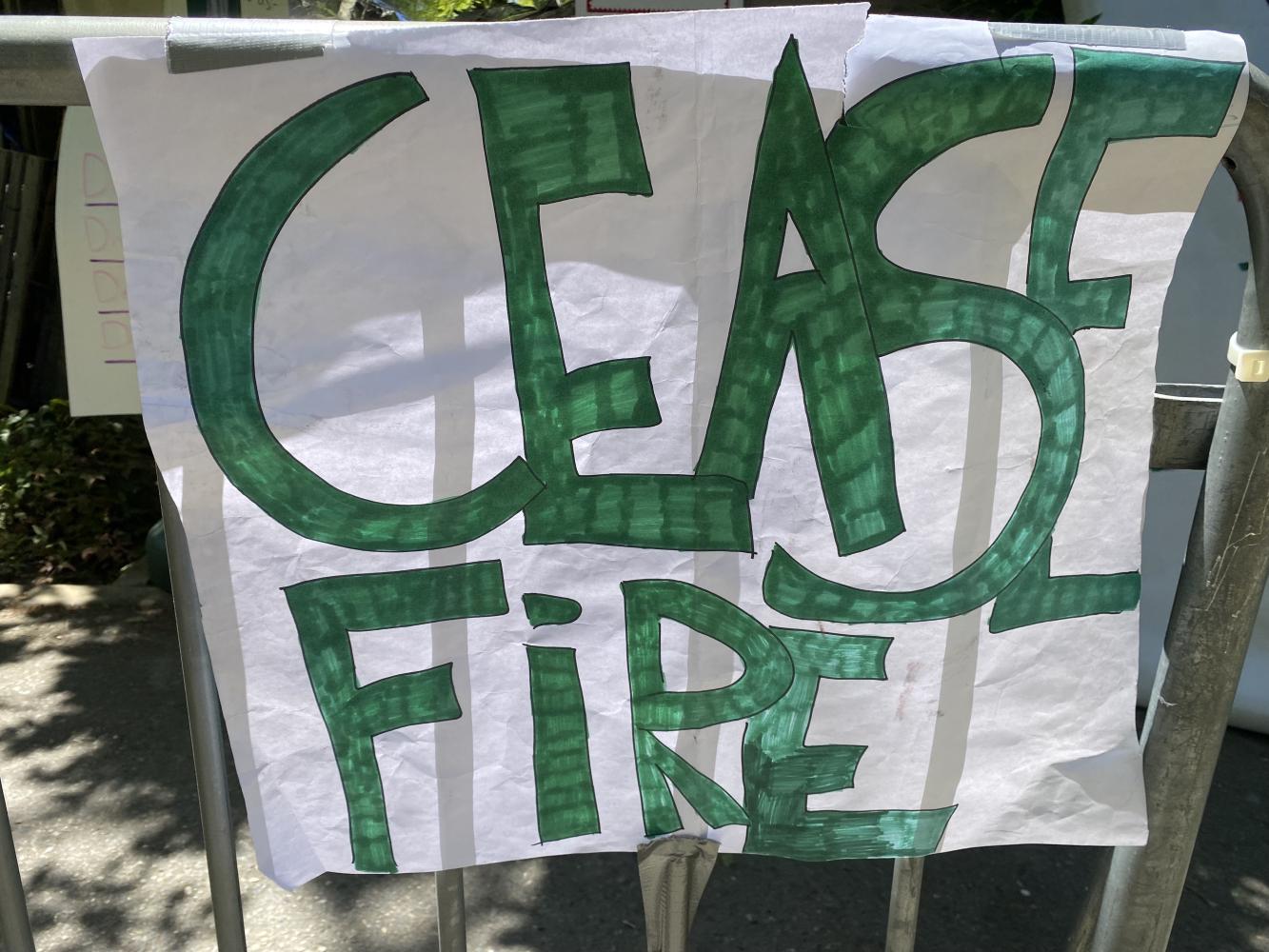 protest sign, "cease fire"